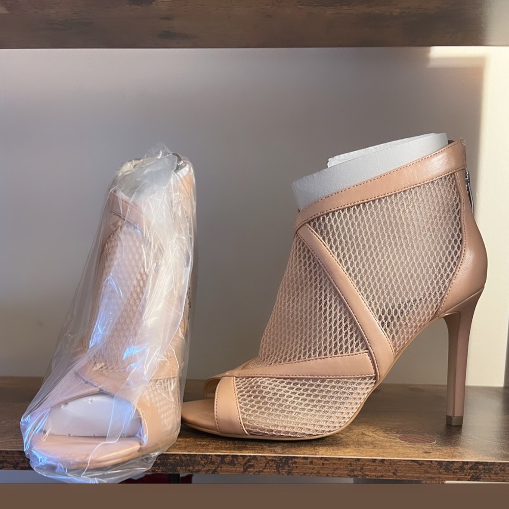 NiNe WEsT asymmetrical peek toe booties.
